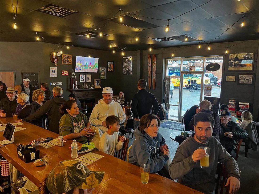 Crowd hanging out inside the Southern Range Brewing taproom