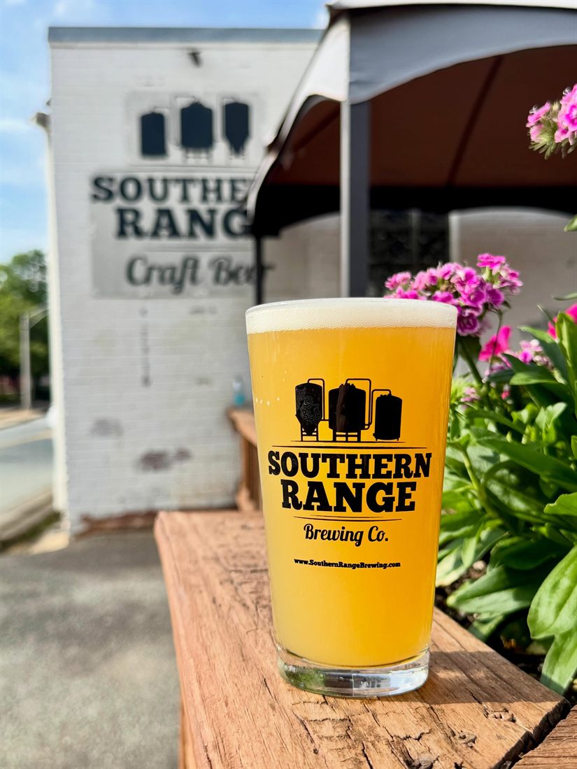 Fresh hazy pour in a Southern Range pint glass outside the Monroe taproom